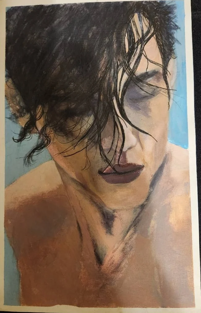 Portrait with dark loose hair falling across a closed eye